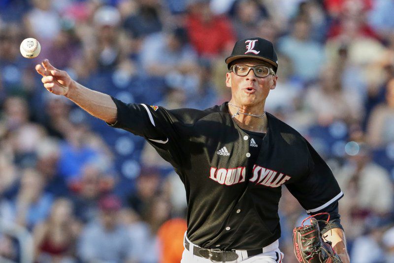 Louisville pitcher Luke Smith throws to first base